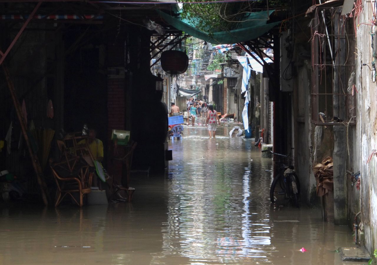 People walk through a flooded residential area in Shantou, China, on September 23.