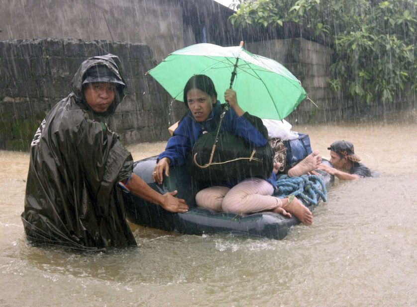 Soldiers rescue trapped residents northwest of Manila, Philippines, on September 23.