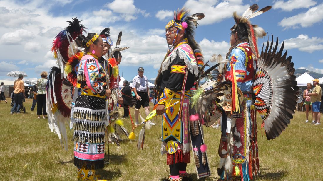 <strong>Native American communities:</strong> Native American dancers talk before competing in dance competitions at Taos Pueblo. The annual Taos Pueblo Pow Wow is one of the country's largest gatherings of Indian nations.