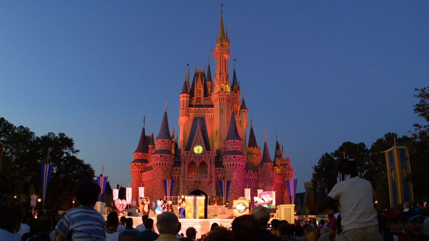 Caption:	 397155 13: People watch a show on stage in front of Cinderella's castle at Walt Disney World's Magic Kingdom November 11, 2001 in Orlando, Florida. (Photo by Joe Raedle/Getty Images)