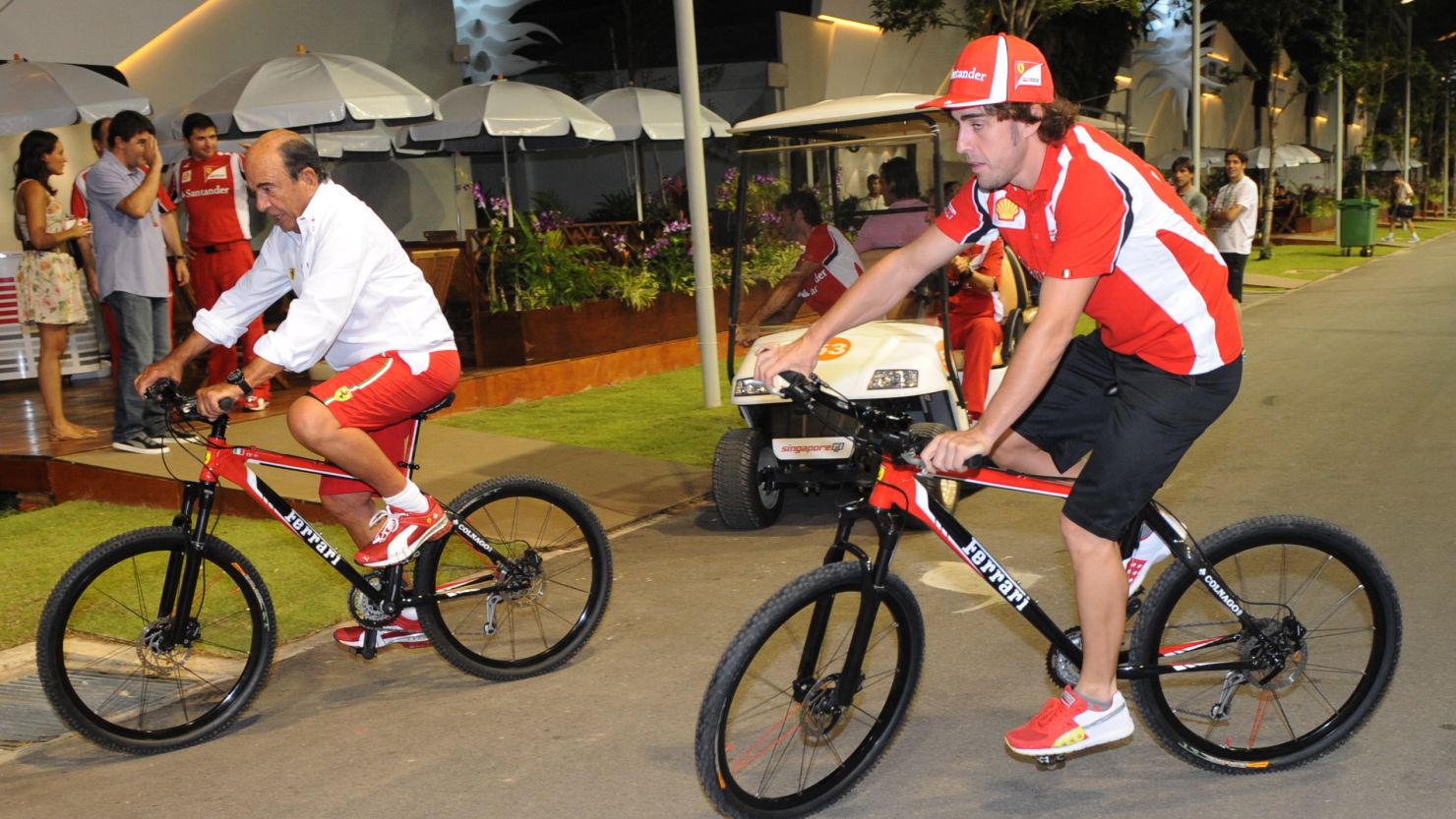 Formula One racer Fernando Alonso, right, hasn't ruled out starting his own cycling team. 