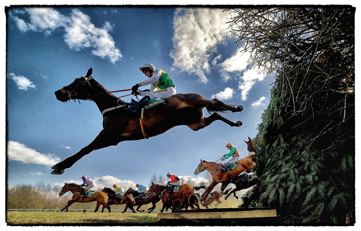 <strong>Aintree, Liverpool, UK: </strong>Horses and jockeys negotiate the famous Bechers Brook fence during The John Smith's Foxhunters Steeple Chase. Crowhust took four cameras to Aintree in April, this year. "I had three remote cameras and one in hand which sets off the other three. They're only jumping once, so you've got to make the most of the oportunity," he says. "You get nice shapes in jumping as well when (the horses) stretch." 