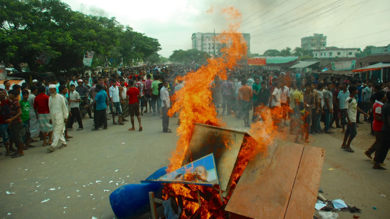 Protesters burn a desk and other items in Gazipur.