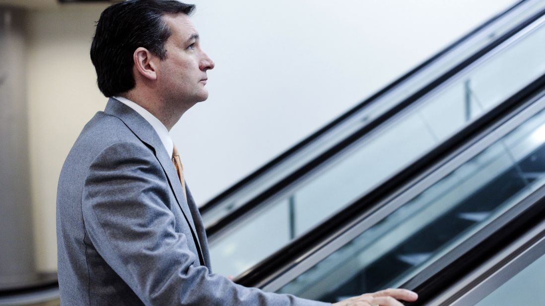 Cruz heads to the weekly Senate Republicans policy luncheon in Washington in March 2013.
