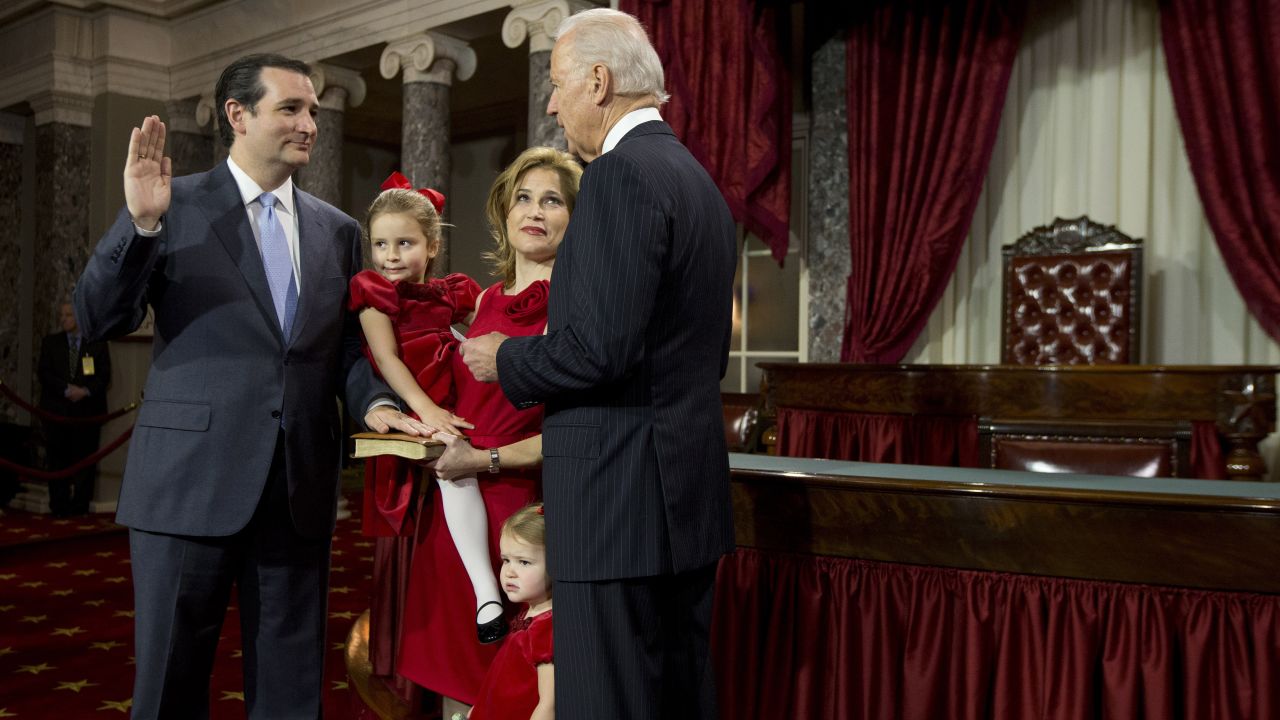 Vice President Joe Biden administers the Senate oath to Cruz during a mock swearing-in ceremony in January 2013. Cruz was accompanied by his wife, Heidi Nelson, and his two daughters, Caroline and Catherine.