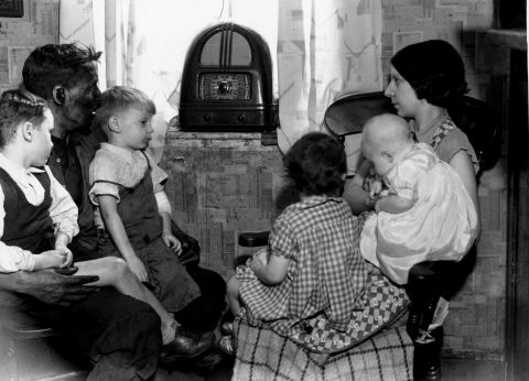 By the 1930s, radio was flourishing. Families gathered around to listen to the latest entertainment and news.
