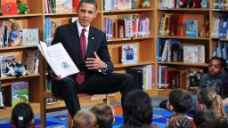 President Barack Obama reads "Night Before Christmas" to second graders at Long Branch Elementary School in Arlington, Virginia, in December 2010.