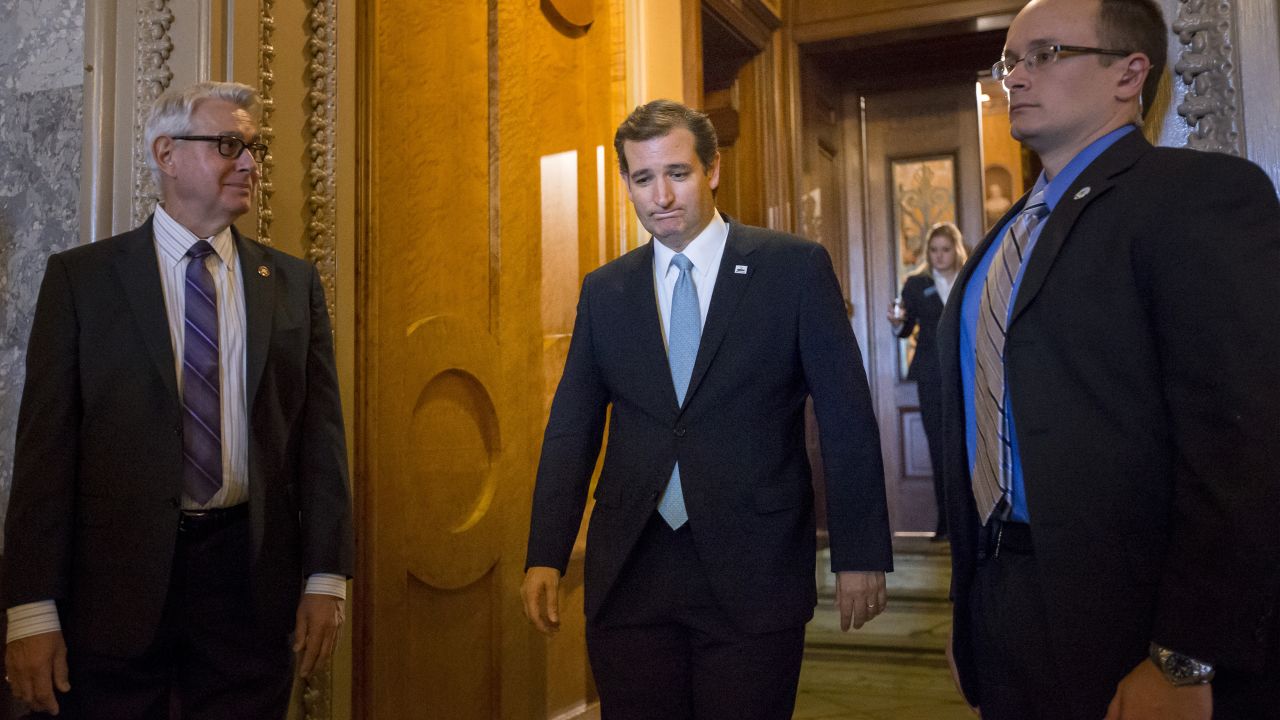 Cruz emerges from the Senate chamber after spending more than 21 hours railing against Obamacare in September 2013.
