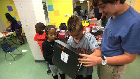 Nicholas Lowinger often brings the donated shoes right to the children himself.
