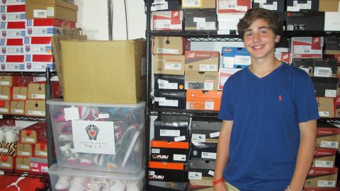 Nicholas Lowinger has a garage full of donated shoes at his family's home in Rhode Island.