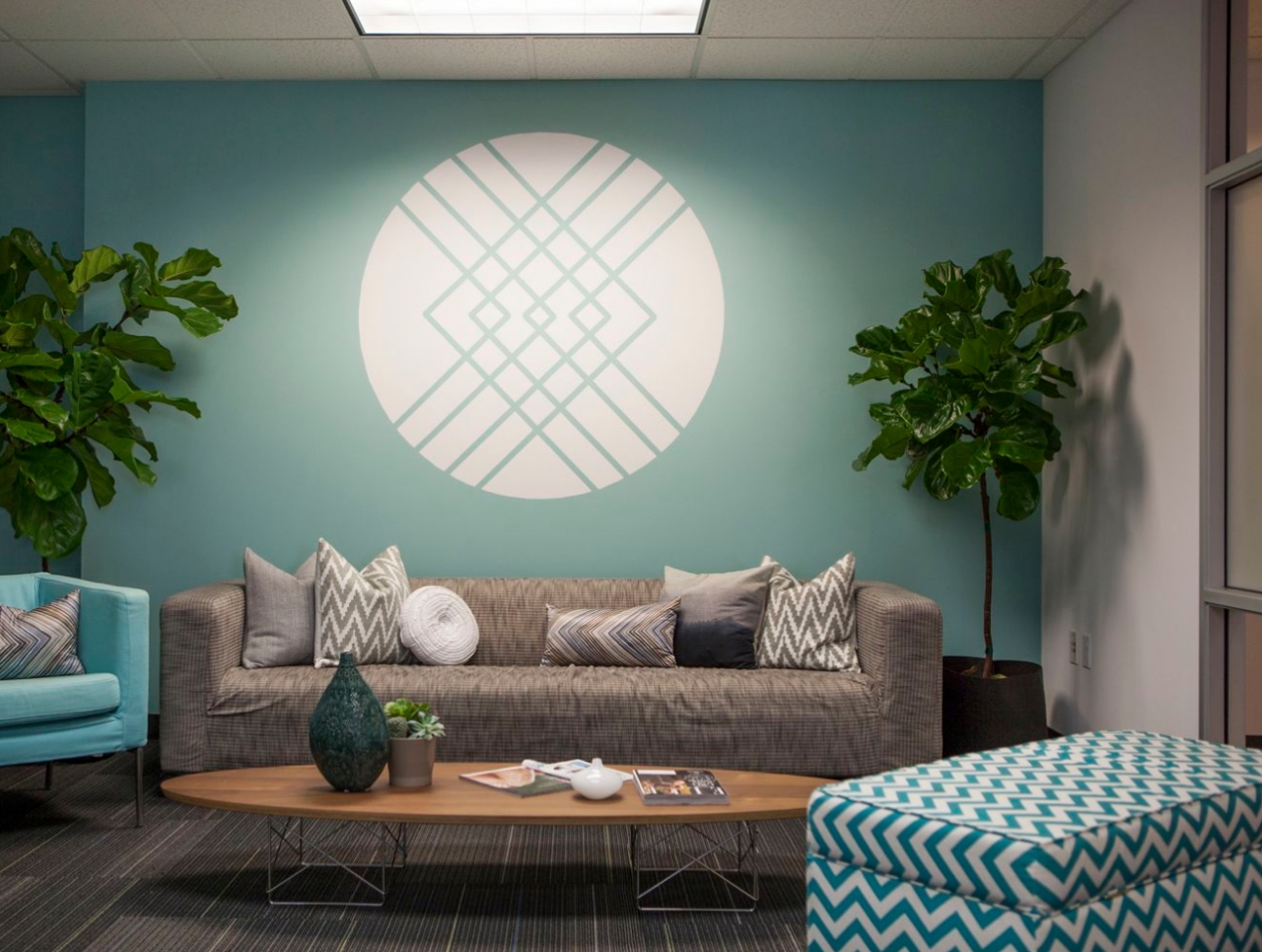 The lobby of Stitch Fix was designed to reflect the online styling service's casual and chic esthetic. The logo on the wall is a DIY project created with a projector and painters tape.
