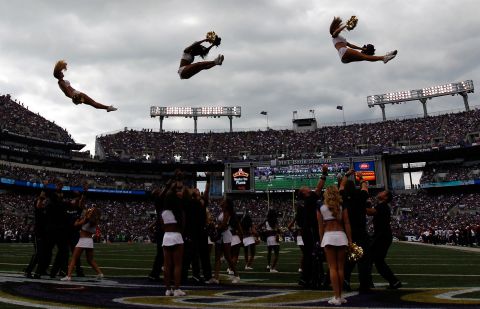 Is it a bird or is a plane? No it is the Baltimore Ravens cheerleaders performing during the second half of the game against the Houston Texans.