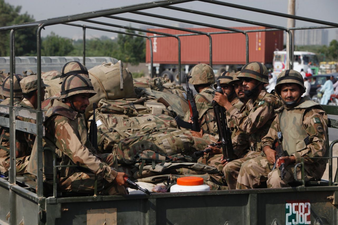 Members of Pakistan's army prepare to travel to Balochistan province from Karachi on September 25.