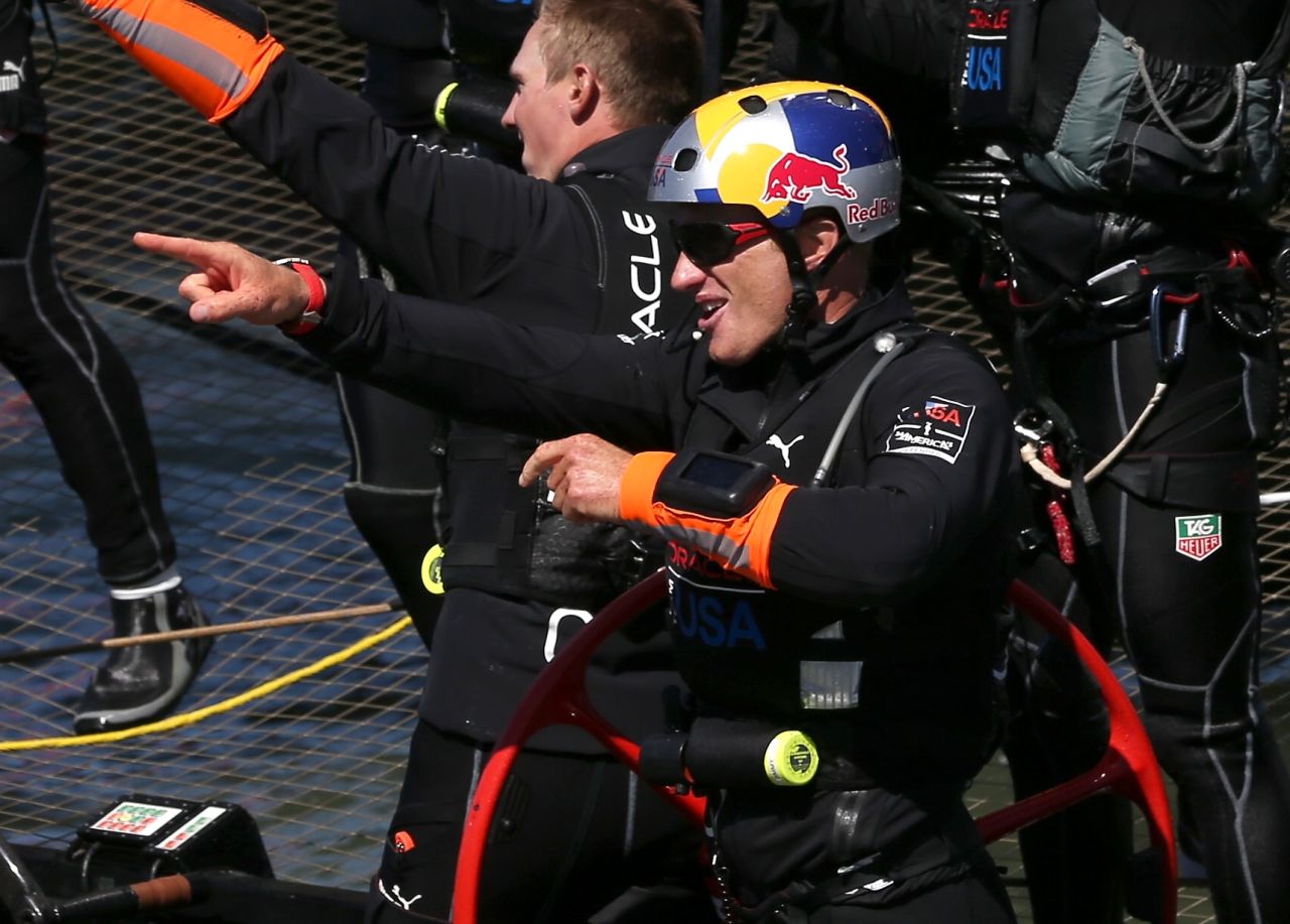 Oracle Team USA skipper Jimmy Spithill celebrates the victory following the race's dramatic conclusion.
