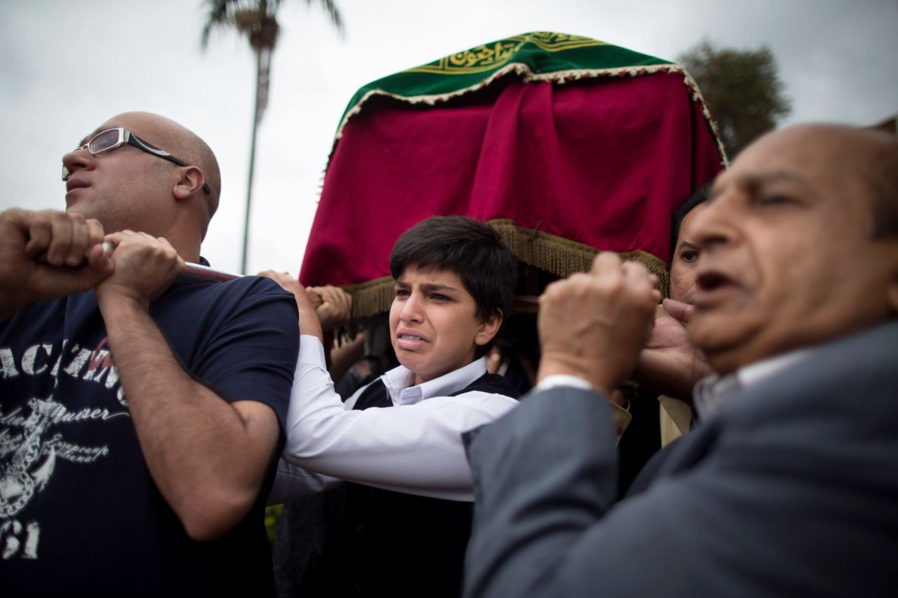 Relatives carry a coffin Wednesday, September 25, during a funeral procession for Selima Merali and her daughter Nuriana Merali, who were killed by gunmen in the attack at the Westgate Shopping Mall in Nairobi, Kenya.