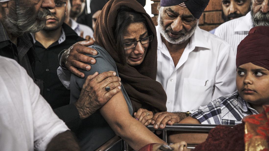 Members of the Kenyan Sikh community cremate a woman and boy on September 25.