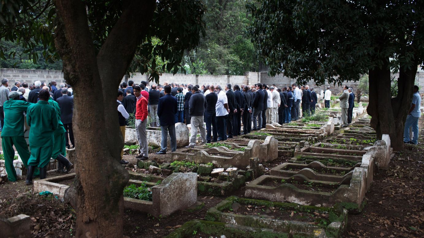 People gather for a funeral on September 25.