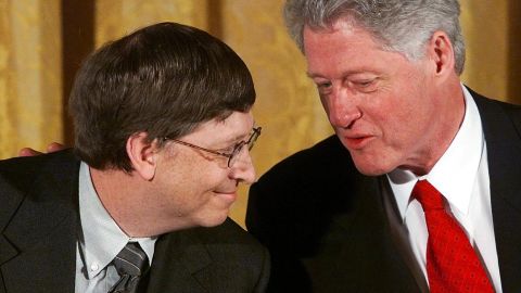 Gates and former U.S. President Bill Clinton attend a White House conference on "the New Economy" in April 2000.