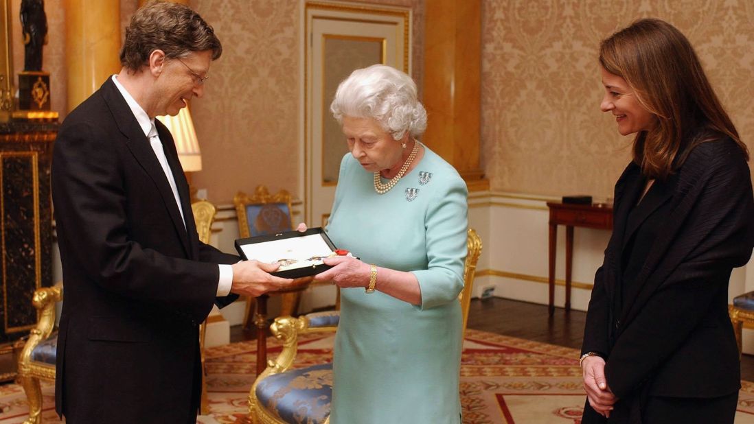 Britain's Queen Elizabeth II presents Gates with an honorary knighthood, as his wife, Melinda Gates, watches. Despite the 2005 honor, Gates can't use the title "Sir" because he's not a British citizen. 
