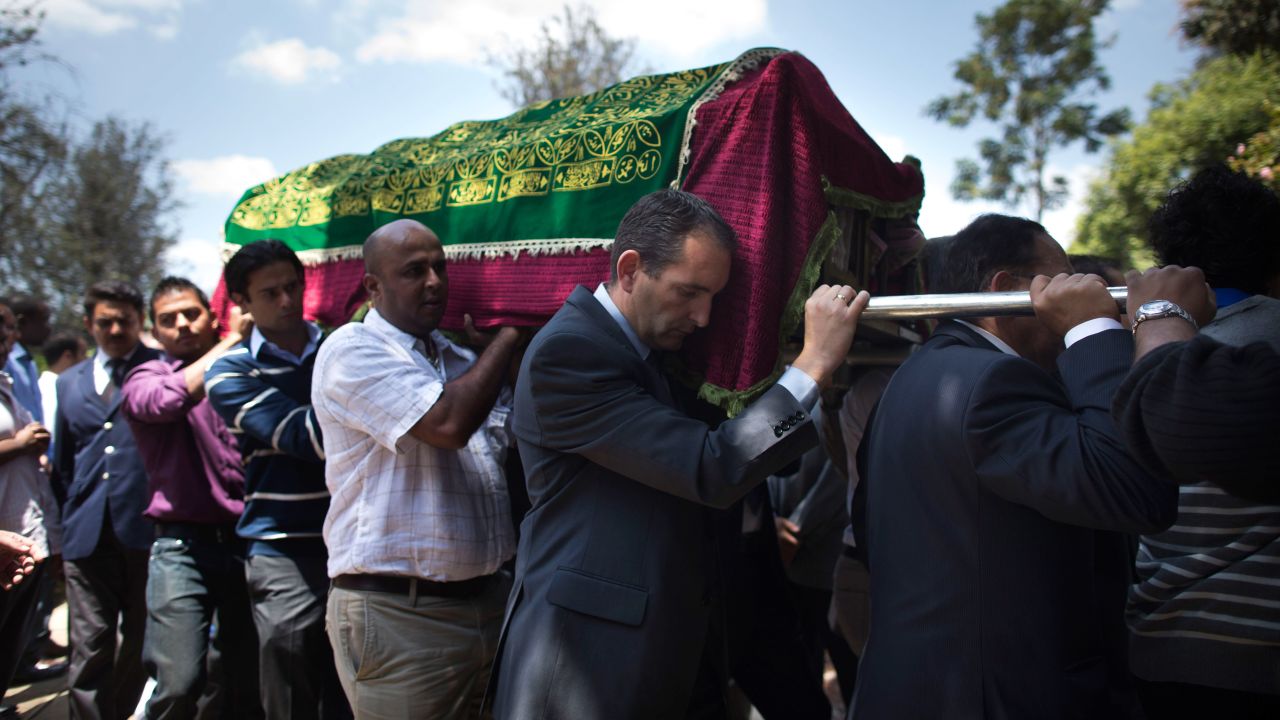 Relatives and friends carry the coffin of Ruhila Adatia Sood, a Radio Africa television and radio presenter, during her funeral in Nairobi on September 26.