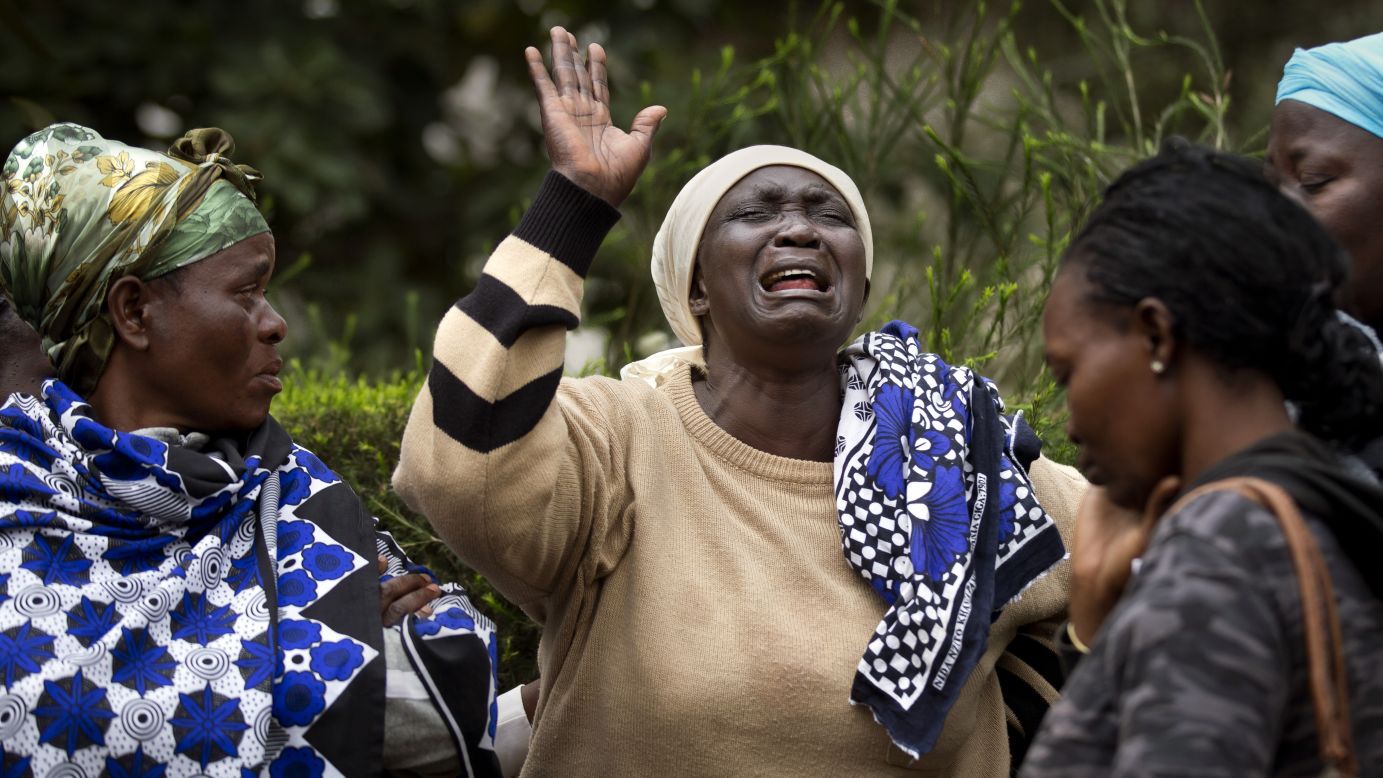 Mary Italo, center, grieves for her son Thomas Abayo Italo as they wait to receive his body at the mortuary in Nairobi on September 25.