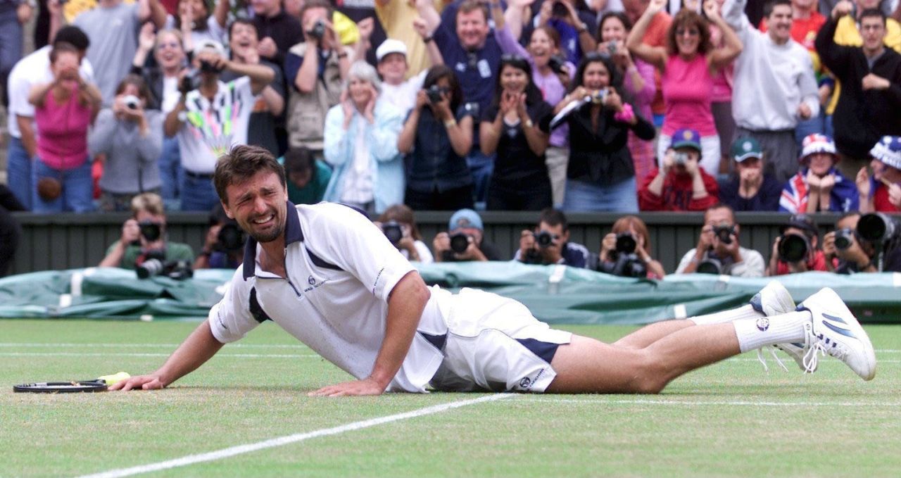 An emotional Goran Ivanisevic hit the floor after becoming the first wildcard entry to win Wimbledon in 2001. The Croatian came into the final after a five-set semifinal against Tim Henman. He had to call on physical and mental reserves to beat Pat Rafter to the trophy in another seesaw five-set epic.