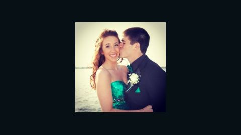 Alyssa J. O'Neill getting a kiss from Dylan Ukasic during senior prom pictures at the Erie, PA bayfront
