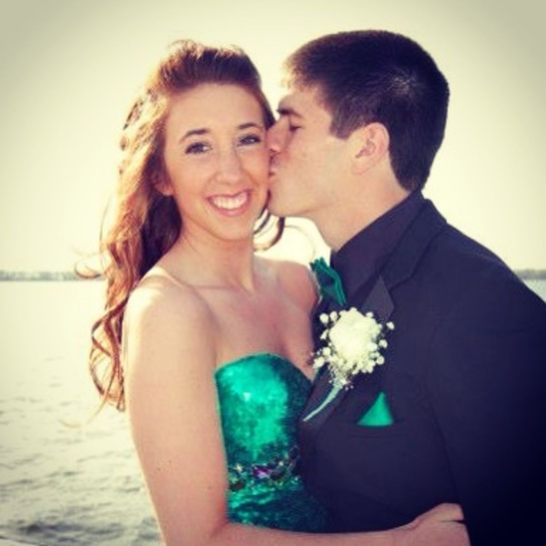 Alyssa J. O'Neill getting a kiss from Dylan Ukasic during senior prom pictures at the Erie, PA bayfront