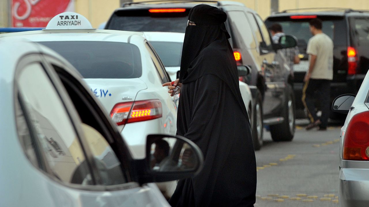 A Saudi woman waits for a taxi outside a shopping mall in Riyadh on June 22, 2012.