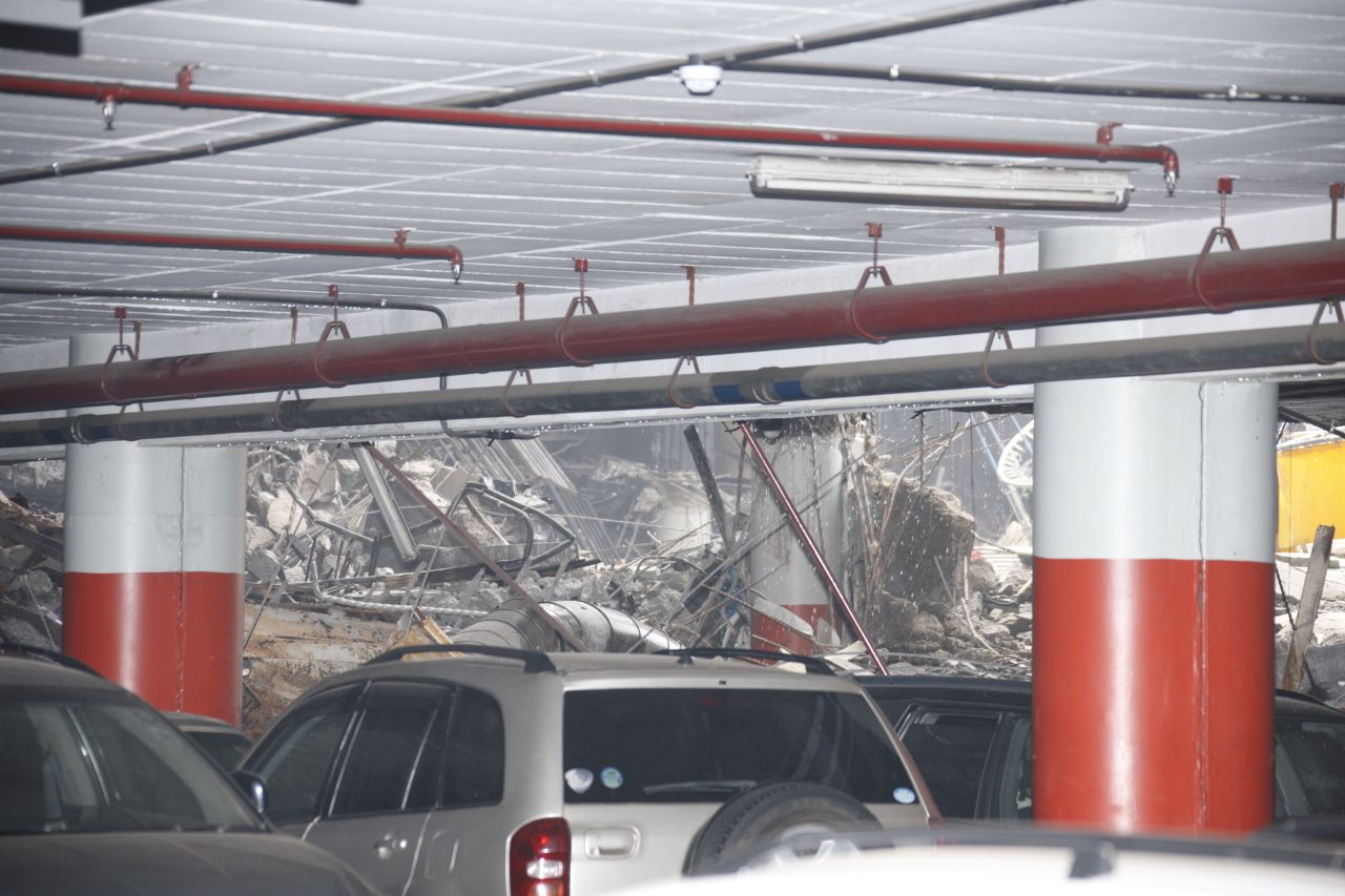 Some vehicles look unscathed on a lower level of the structure. 