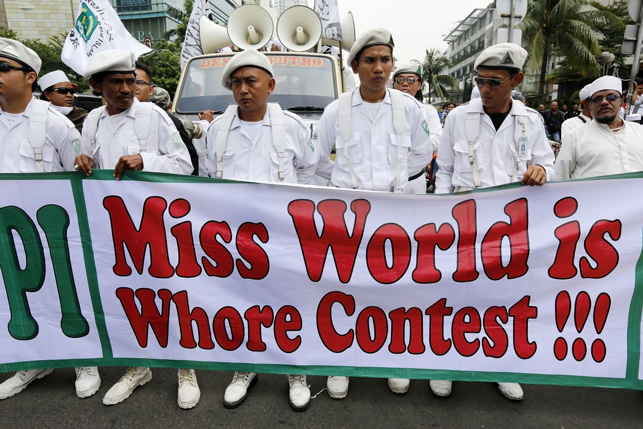Members of the conservative Islamic group, the Islamic Defenders Front held signs reading "Tolak (Reject) Miss World" and "Miss World is Whore Contest" in protest against the competition on September 3 in Jakarta, Indonesia. 
