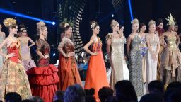 In this photograph taken on September 24, 2013, Miss World contestants who were selected as top 10 in the fashion show pose during the event at the convention center in Nusa Dua, in Indonesia's resort island of Bali. The top 10 in the modeling event, automatically enters the top 15 in the finals on September 28, 2013. The top 10 seen in the front row from left Miss Ukraine, Anna Zaiachkivska; Miss Brazil, Sancler Frantz Konzen; Miss France, Marine Lorpheline; Miss Cyprus, Kristy Marie Agapioy; Miss Italy, Sarah Baderna, Miss United States, Olivia Jordan; Miss England, Kirsty Heslewood; Miss Cameroon, Denise Valerie Ayena; Miss Philippines Megan, Young; Miss South Sudan, Modong Manuela Mogga, The Miss World final takes place on the Indonesian resort island of Bali on Saturday after weeks of protests from Muslim hardliners and warnings that extremists could attack the pageant. AFP PHOTO / SONNY TUMBELAKA (Photo credit should read SONNY TUMBELAKA/AFP/Getty Images)