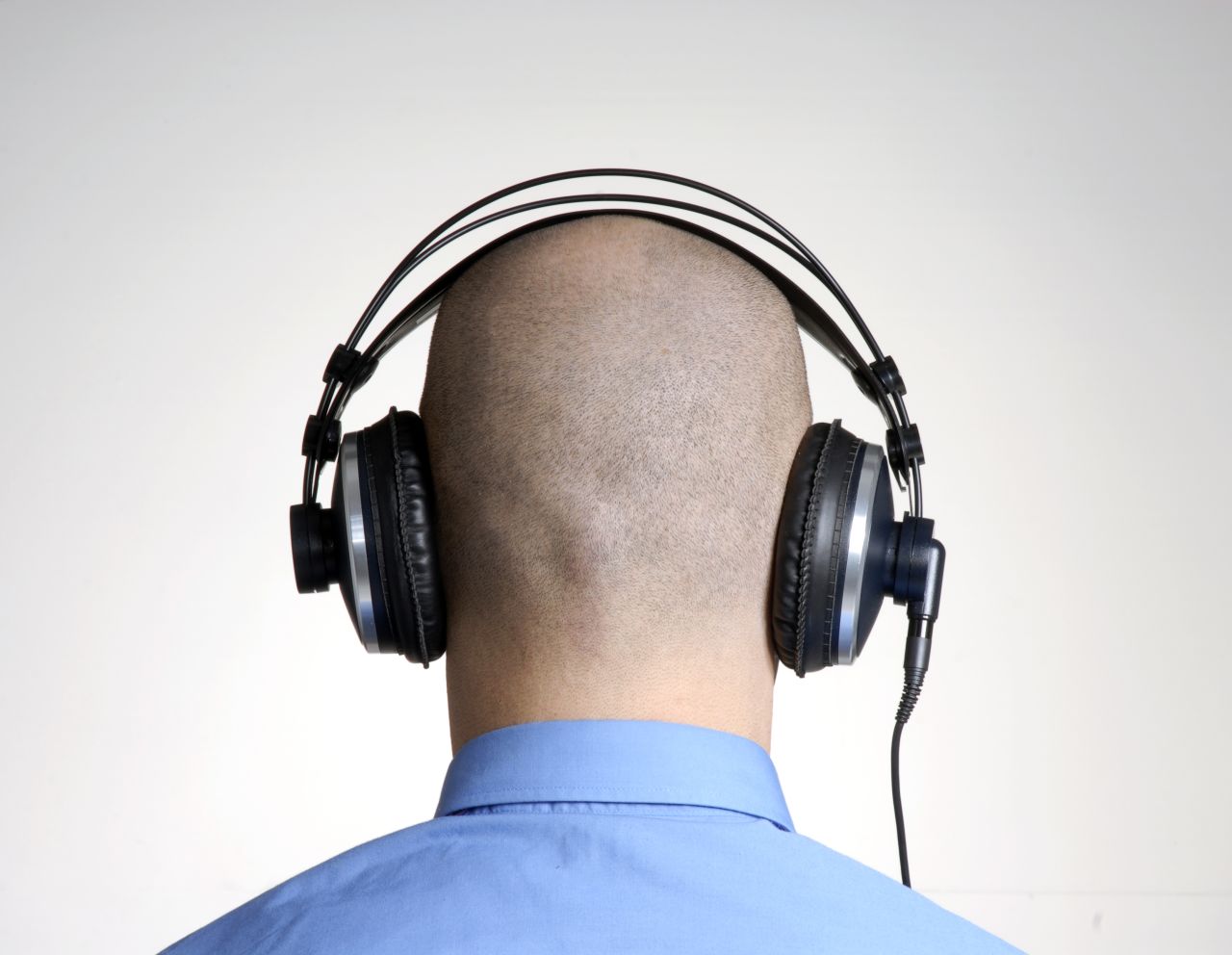 bald man headphones