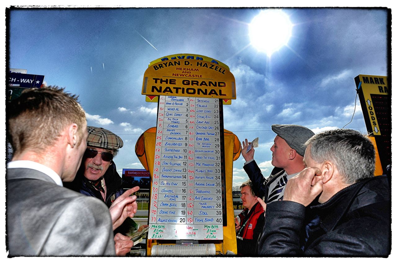 <strong>The Grand National, Aintree, Liverpool, UK: </strong>A bookmaker taking bets on the Grand National in April. The first official running of the world's most famous handicap steeplechase took place in 1839.  