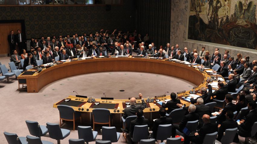 The United Nations Security Council votes to approve a resolution that will require Syria to give up its chemical weapons during a meeting on Friday, September 27, at UN headquarters in New York on the sidelines of the 68th Session of the United Nations General Assembly.