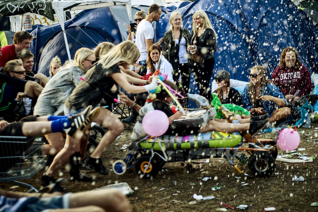 Life isn't always a party in Denmark, but people are happy anyway, like these at the Roskilde festival.