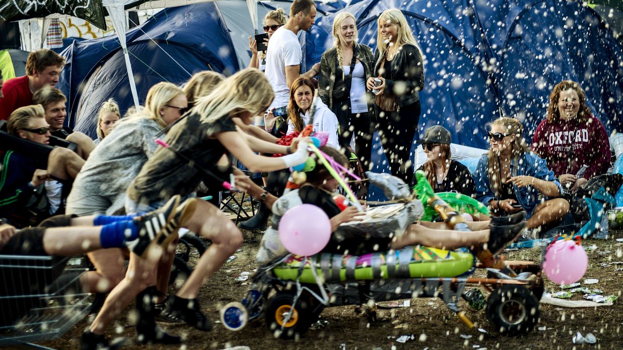 Life isn't always a party in Denmark, but people are happy anyway, like these at the Roskilde festival.