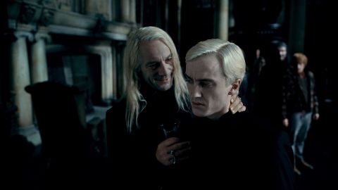 Jason Isaacs, left, as Lucius Malfoy and Tom Felton as the mean and creepy Draco Malfoy in "Harry Potter and the Deathly Hallows -- Part 1."