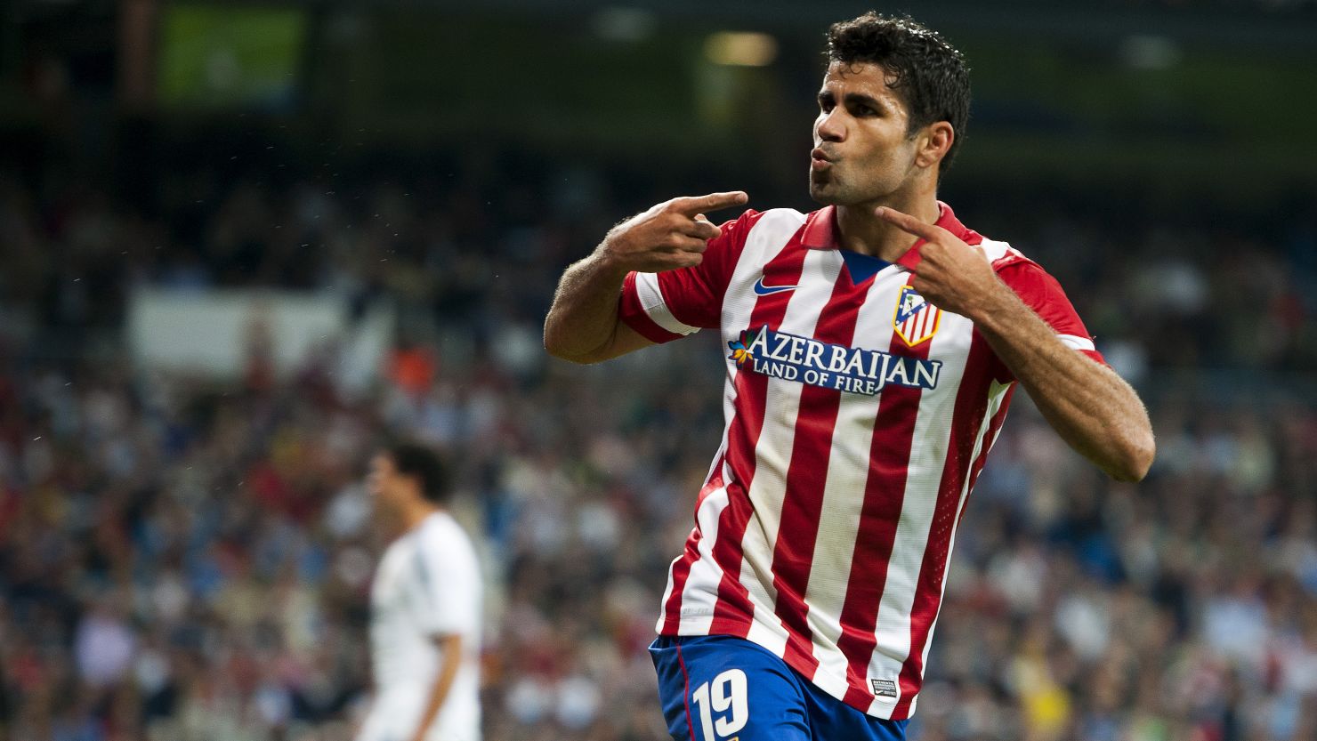 Atletico Madrid striker Diego Costa celebrates after scoring the winning goal against Real Madrid at the Bernabeu on Saturday. 