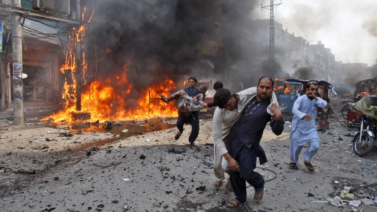 Injured victims are carried away after the blast.