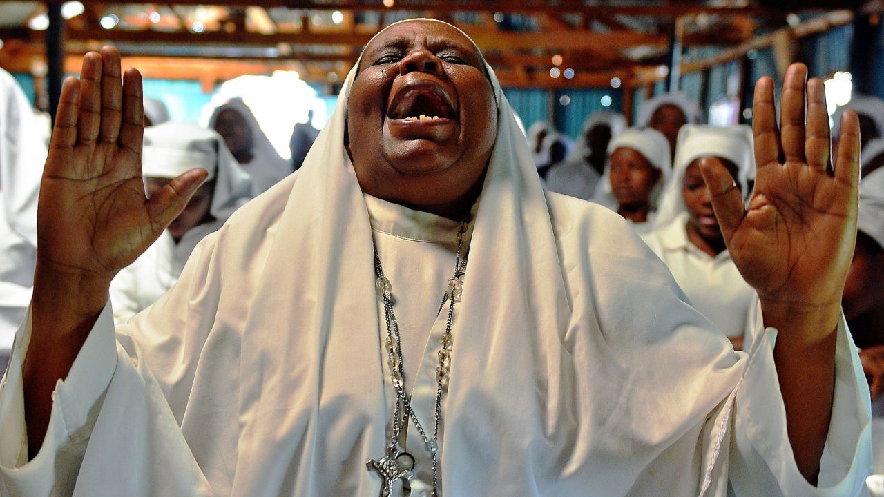 A woman shouts during a special prayer at the Legio Maria African Mission church in Nairobi, Kenya, on Sunday, September 29, for the victims of the Westgate Shopping Mall shooting.