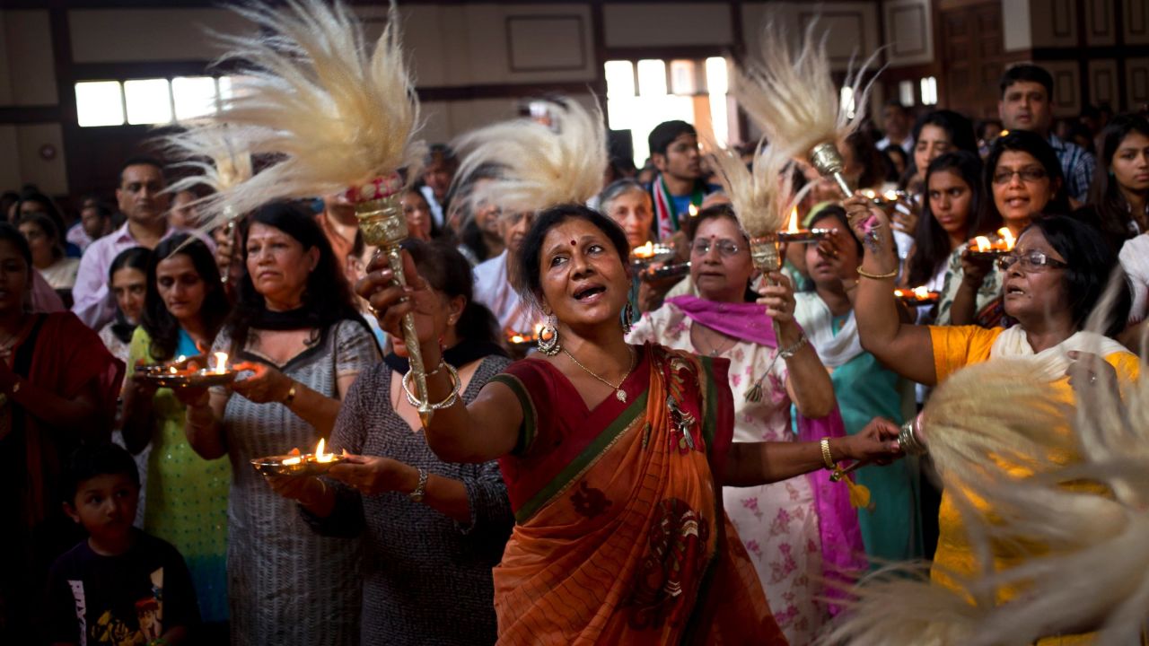 Kenyan Jainists dance as they reach the end of a continuous 24-hour prayer session on September 29 at the Oshwal Center next to the Westgate Mall.