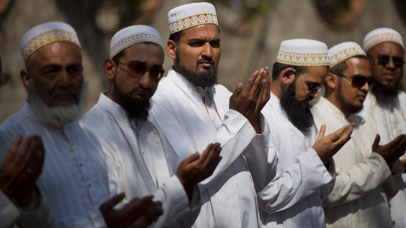 Muslim men pray at a memorial service outside the Westgate Mall on September 29.