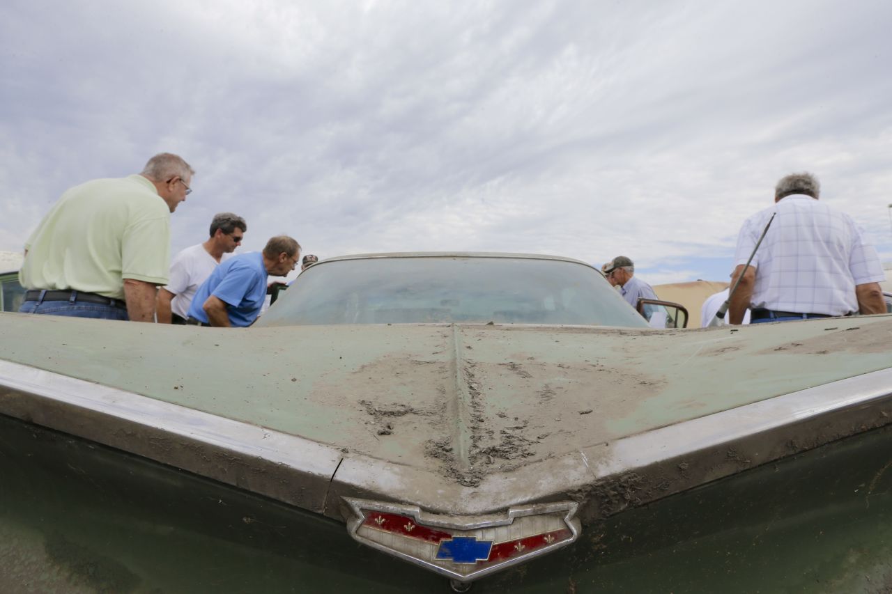 Car enthusiasts look over a 1959 Chevrolet Belair on Friday.