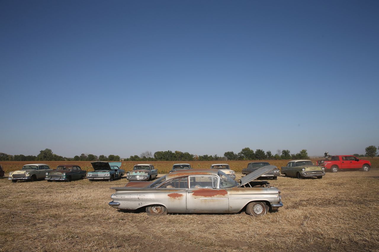 Classic cars are lined up in a field on the Lambrecht family farm on Thursday.