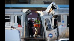 Emergency personnel investigate the scene where dozens of people were taken to hospitals after a CTA train ran head-on into another train that was stopped at a Blue Line station in Forest Park, Illinois, Monday, September 30, 2013. (Chuck Berman/ Chicago Tribune/MCT via Getty Images)