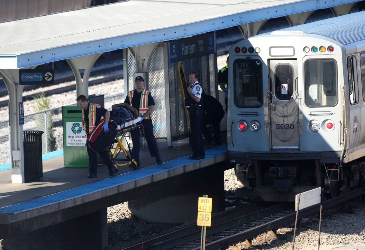An injured rider is transported after the crash. Authorities are looking at video feeds from the platforms and from some rail cars.