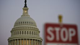 A stop sign is seen at dusk next to the US Congress building on the eve of a possible government shutdown as Congress battles out the budget in Washington, DC, September 30, 2013. AFP PHOTO/ MLADEN ANTONOV (Photo credit should read MLADEN ANTONOV/AFP/Getty Images)
