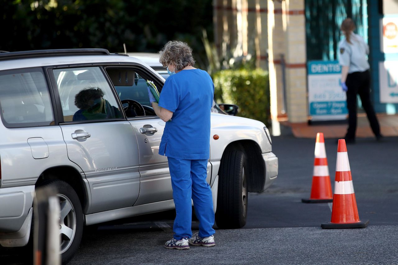 People queue in cars at a coronavirus testing center in Auckland, New Zealand, on June 17.