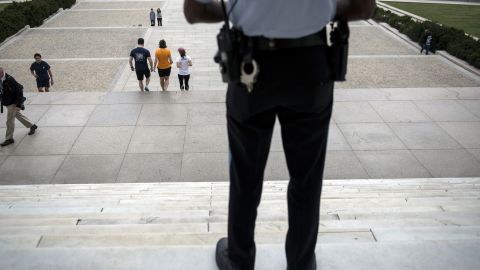 A U.S. park service police officer stands guard at the entrance of the closed Lincoln Memorial on October 1.